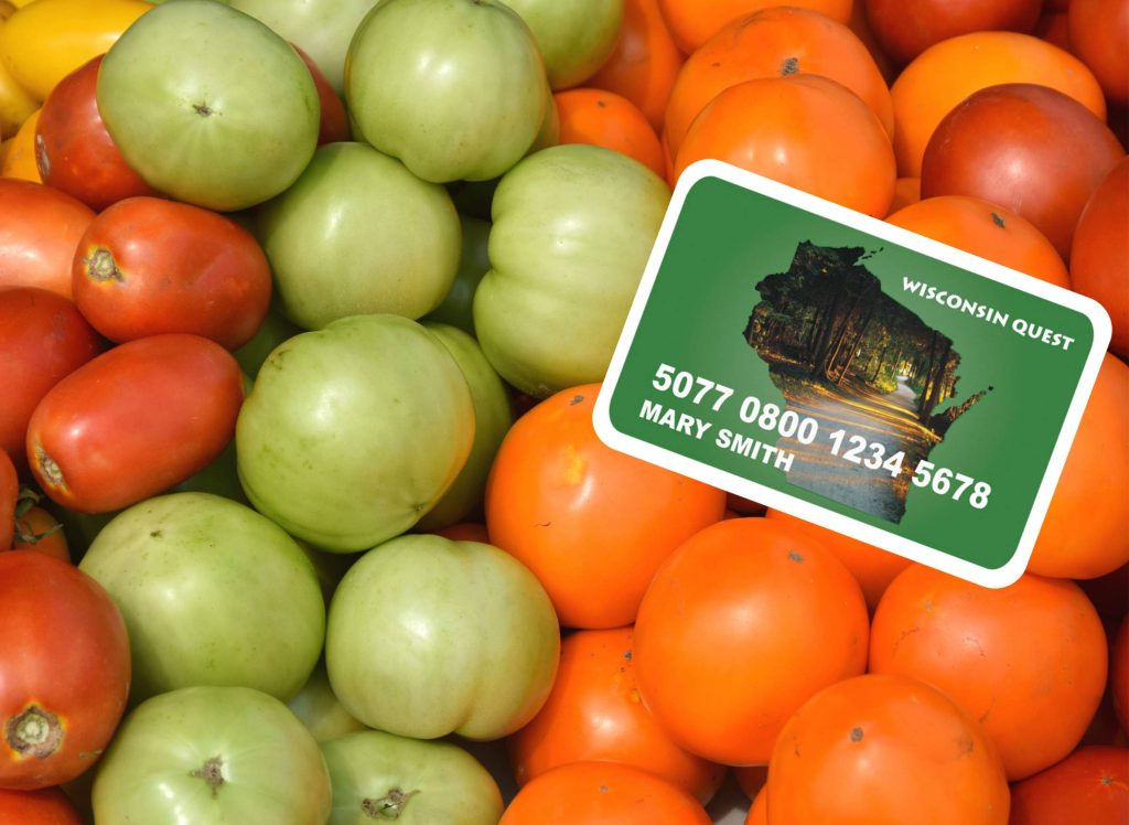 A quest card among a bed of fruit